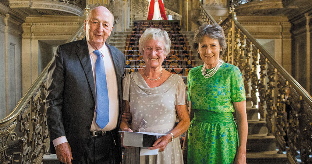 The Duke and Duchess of Devonshire with Pam Wildgoose at the League’s 50th birthday party in The Painted Hall at Chatsworth.