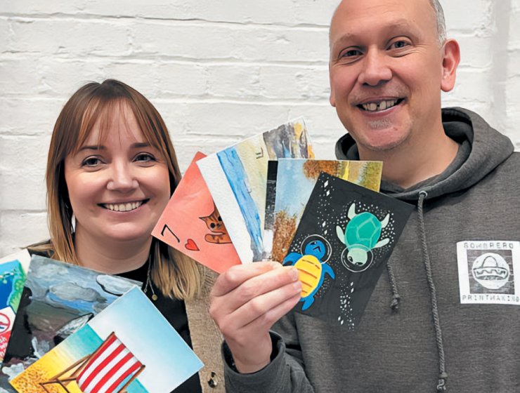 Hanna Bowdler, fundraising coordinator of Junction Arts, with artist Dave Elsom, from Sombrero Printmaking, promoting the 2024 Postcard Show