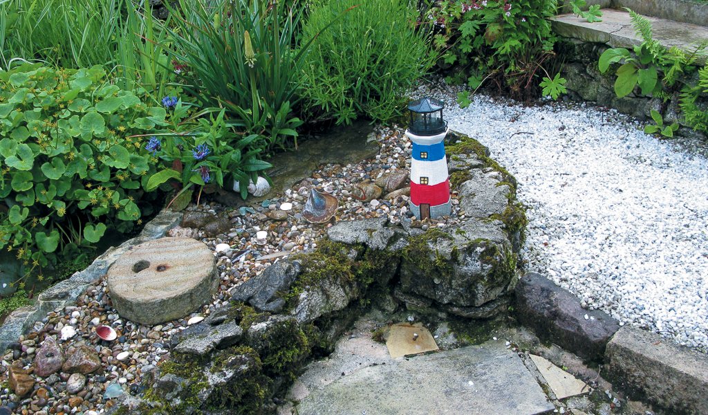 A lighthouse is this corner of a Middleton-by-Wirksworth garden.
