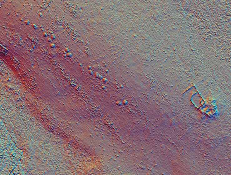 A LiDAR image (laser imaging, detection, and ranging) showing a line of cairns, in the middle of the image) that are hidden by bracken on the Peak District moors. The traditional way of finding and mapping these features would be a walked survey but it’s very time consuming and difficult to achieve amongst all of the vegetation. This survey located more features than had been previously identified because of the innovative methodology employed.