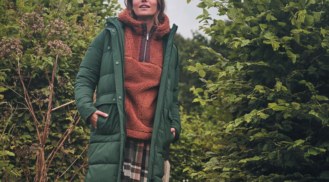 Harley Long Puffer Coat,  £170, Millie Overhead Fleece, £65, and Ceil Check Dress, £69, all FatFace. www.fatface.com