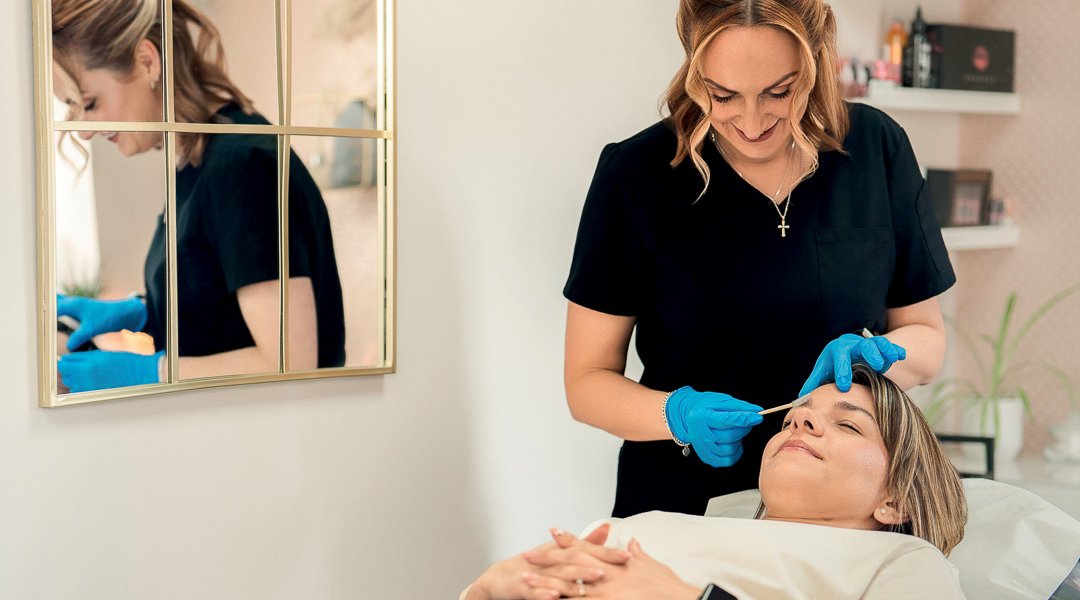 Carly works on an eyebrow treatment. Picture by Helen Rowan Photography