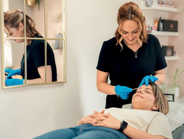 Carly works on an eyebrow treatment. Picture by Helen Rowan Photography