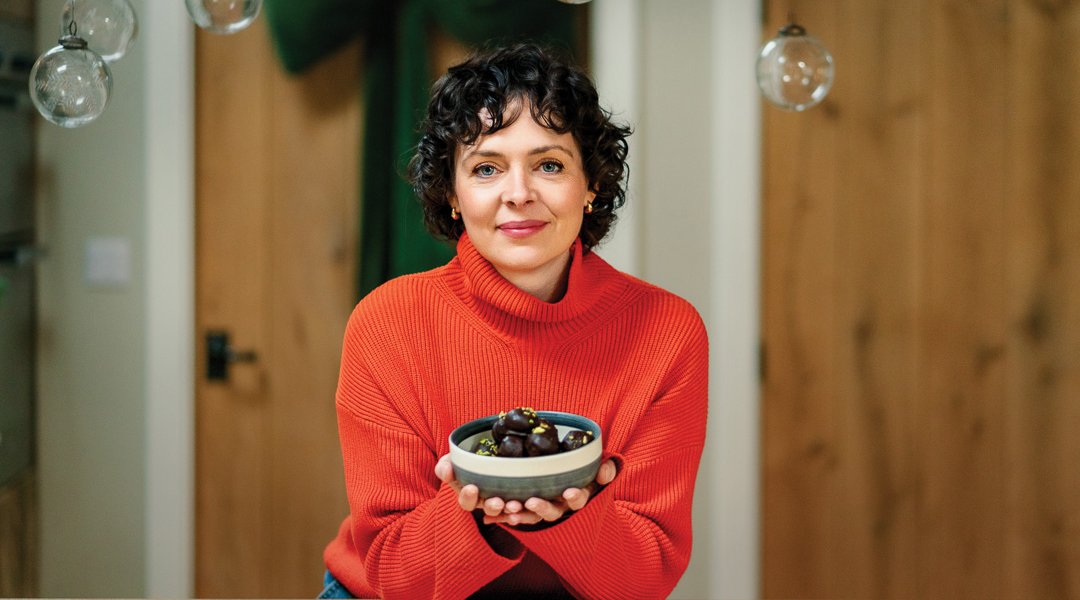 A tasty - yet healthy - treat. Jo Bibby with a bowl of hazelnut energy bites. Picture: Helen Rowan Photography