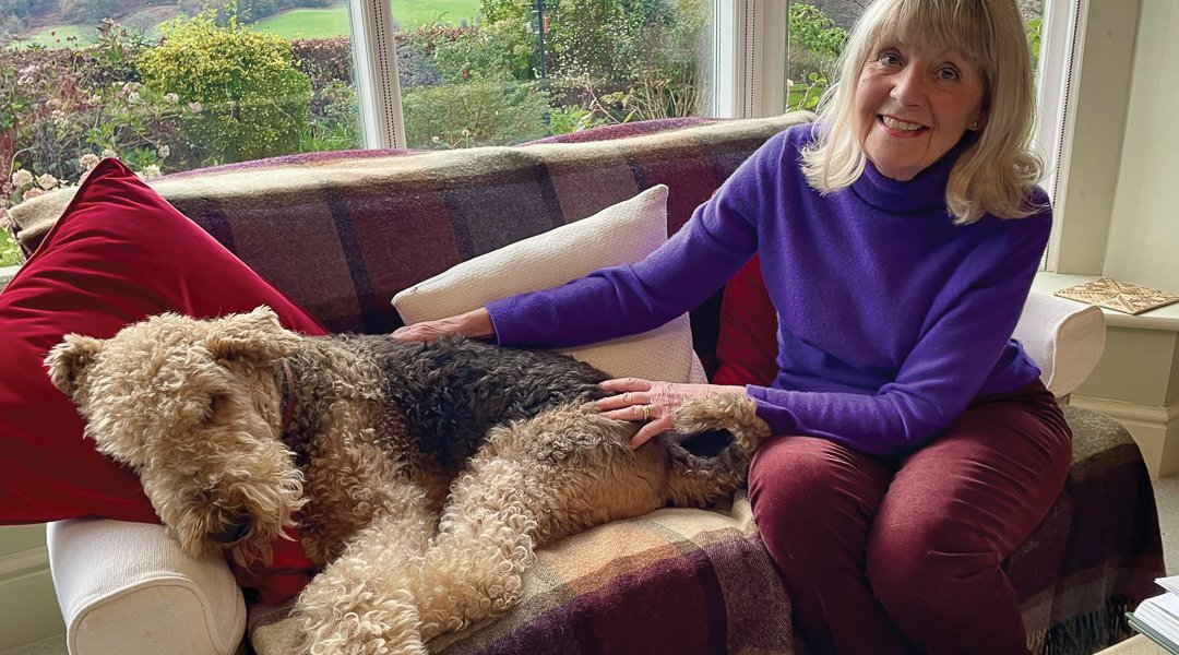 Eileen relaxes at home with her Airedale, Dylan