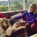 Eileen relaxes at home with her Airedale, Dylan
