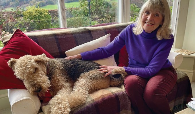 Eileen relaxes at home with her Airedale, Dylan