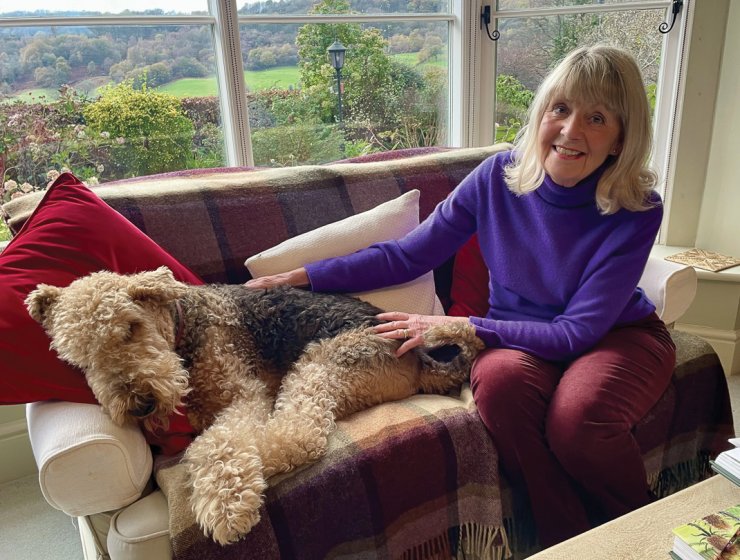 Eileen relaxes at home with her Airedale, Dylan