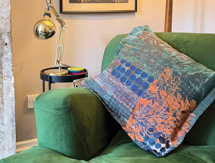 One of Sara’s designs adorns a cushion in the sitting room of her Peak District cottage