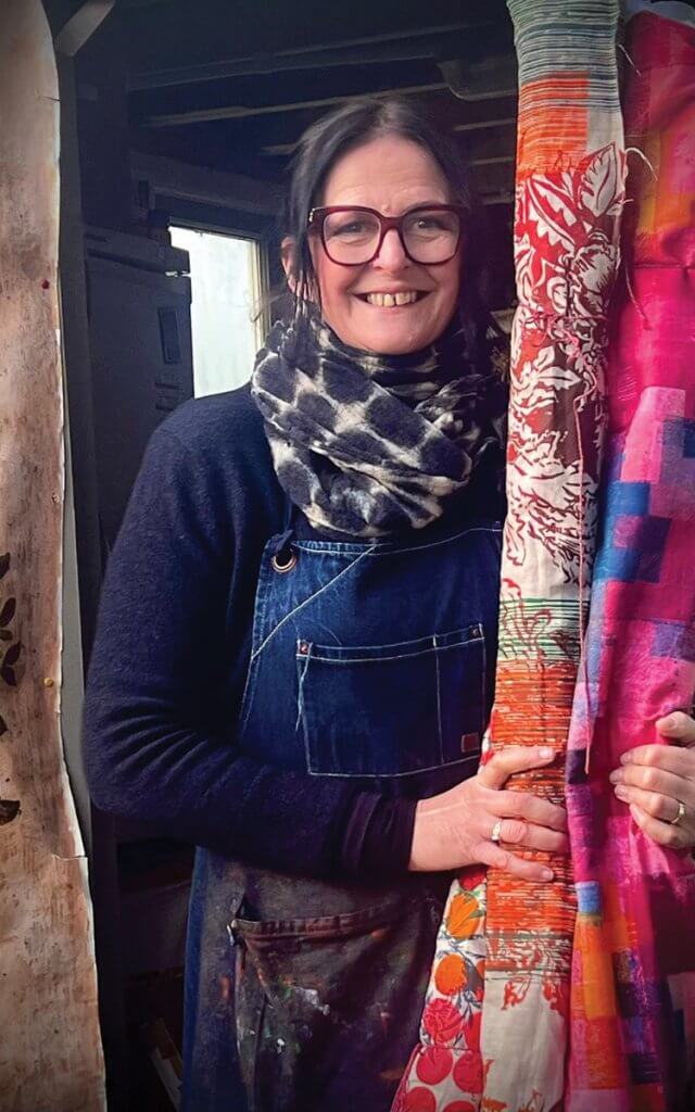 Sara Kirby with rolls of her fabric