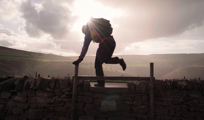 Into the sunlight as Ben scales a stile