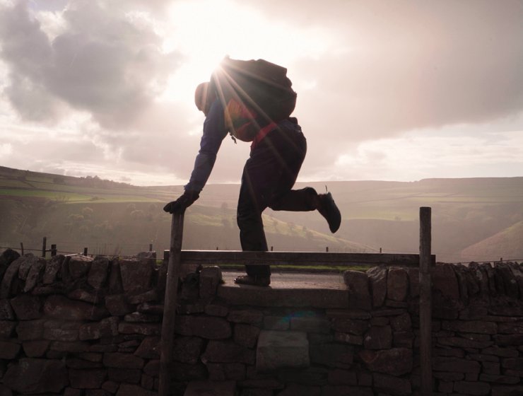 Into the sunlight as Ben scales a stile