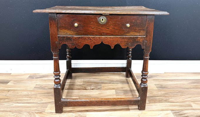 This George I (Reign 1714-1727) oak and ash side table, c.1720, measuring 74cm wide, made £850 in a recent traditional antique auction. Consigned from a deceased estate near Bakewell, the result is considered to be a good price in the current market, showing the continued demand for authentic antique pieces in original condition.
