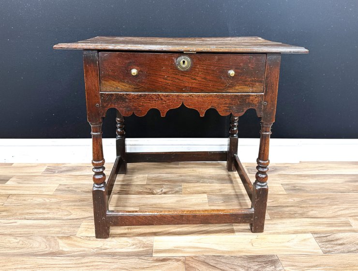 This George I (Reign 1714-1727) oak and ash side table, c.1720, measuring 74cm wide, made £850 in a recent traditional antique auction. Consigned from a deceased estate near Bakewell, the result is considered to be a good price in the current market, showing the continued demand for authentic antique pieces in original condition.