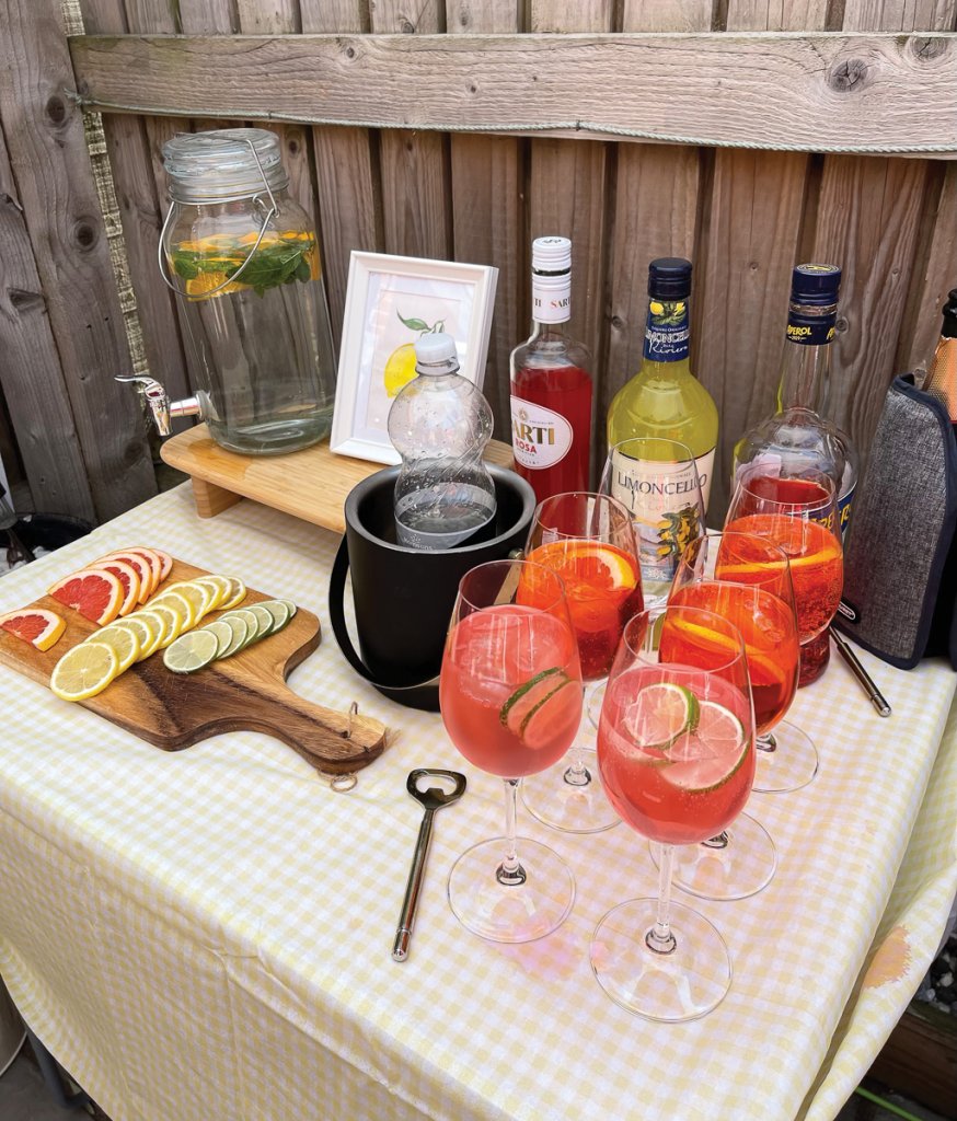 Encourage your guests to help themselves to drinks with a self-serve spritz station