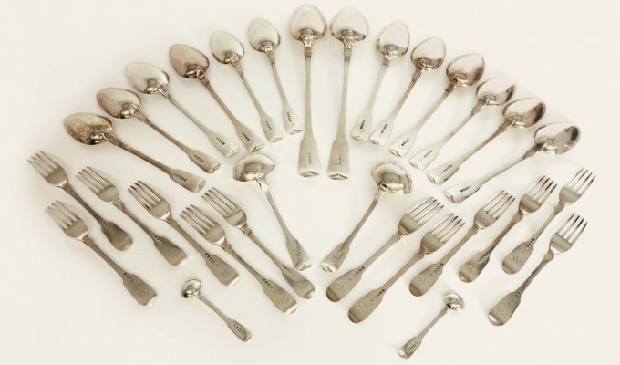 George III silver fiddle pattern set of cutlery, by William Eley, William Fearn and William Chawner, London, 1812, 60oz total. It made £3,300 in a recent specialist auction.