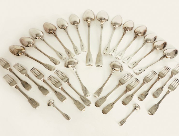 George III silver fiddle pattern set of cutlery, by William Eley, William Fearn and William Chawner, London, 1812, 60oz total. It made £3,300 in a recent specialist auction.
