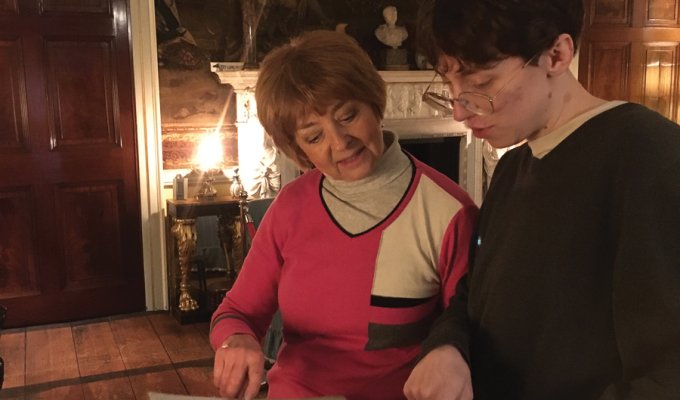 Christine Beevers studies a document with student Elliot Stoszek