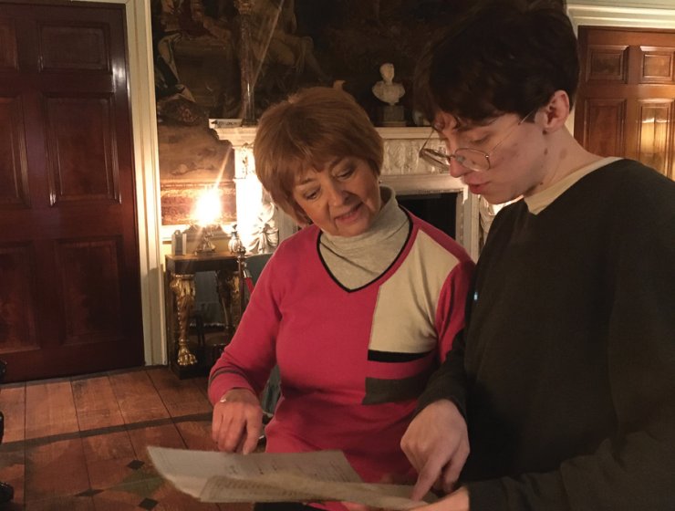 Christine Beevers studies a document with student Elliot Stoszek