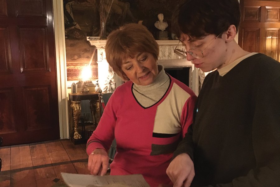 Christine Beevers studies a document with student Elliot Stoszek