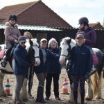 Maggie and Amy with Mid Derbyshire Riding for the Disabled volunteers. Picture: Fiona Stubbs