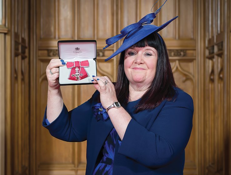 Lisa with her MBE