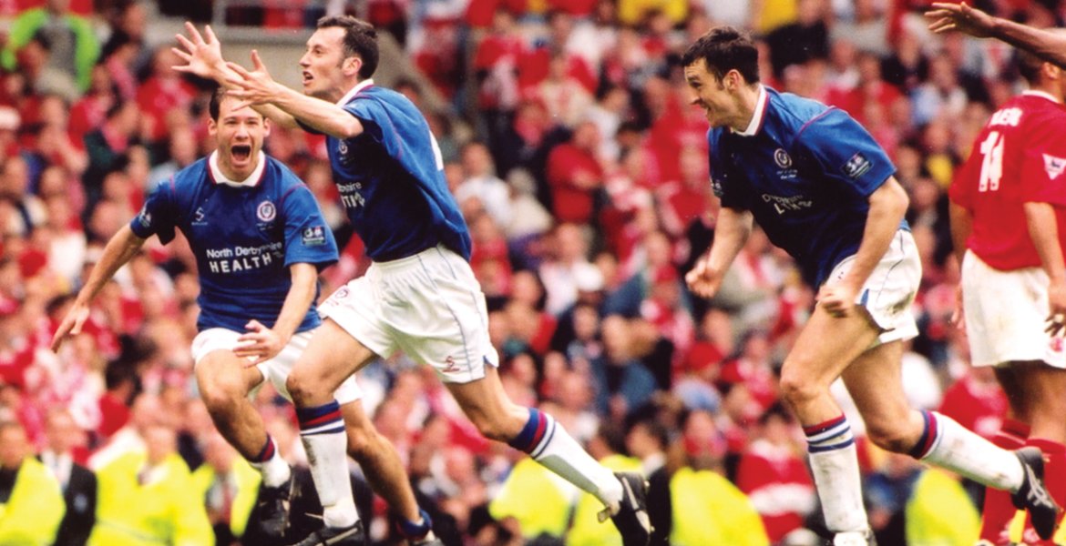 Jamie Hewitt celebrates his last-gasp equaliser against Middlesbrough at Old Trafford alongside Chesterfield teammates Jonathan Howard and Darren Carr. Picture: Chesterfield Football Club