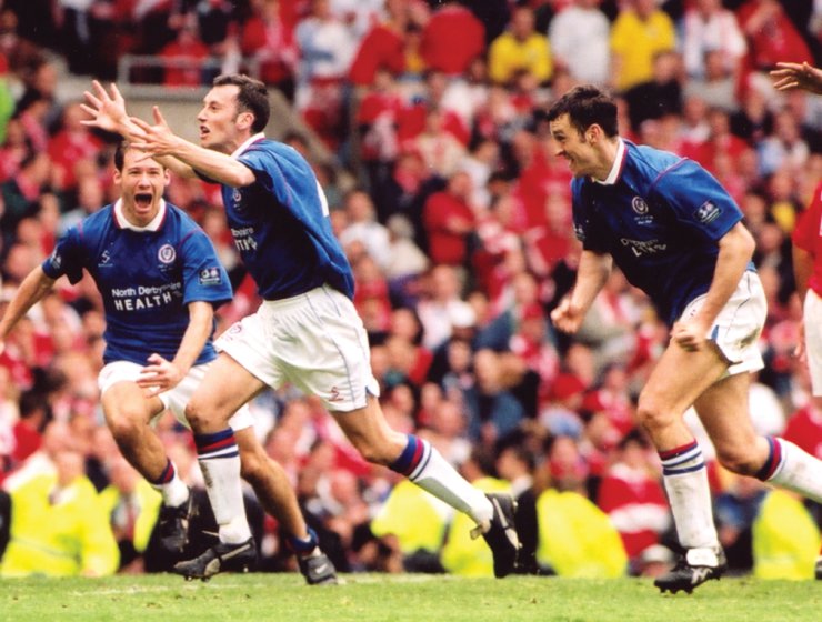 Jamie Hewitt celebrates his last-gasp equaliser against Middlesbrough at Old Trafford alongside Chesterfield teammates Jonathan Howard and Darren Carr. Picture: Chesterfield Football Club