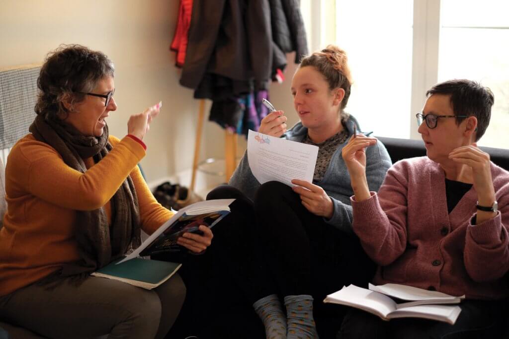 A group of Nora’s students discuss their Spanish learning