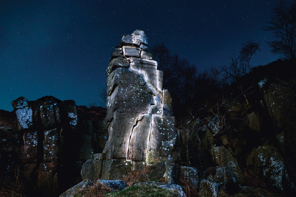 Tegness Pinnacle highlighted by white fairy lights
