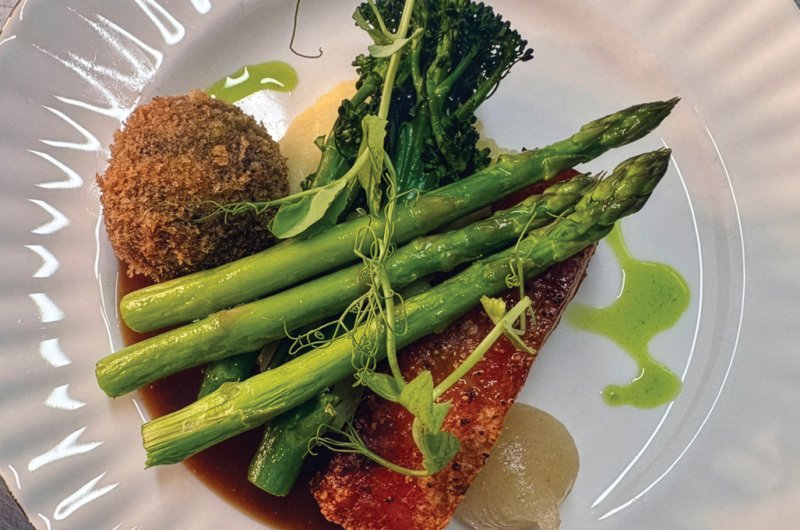 Crispy pork belly, black pudding bon bon, buttery mash, seasonal greens & rich red wine jus