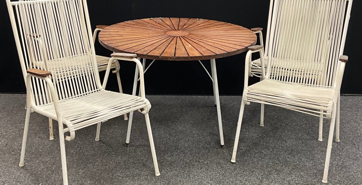 The late 20th century Daneline teak and white tubular metal circular garden table, 99.5cm diameter, with four famous “Spaghetti” chairs. The composite suite was saved from the skip and made £250 in a recent auction