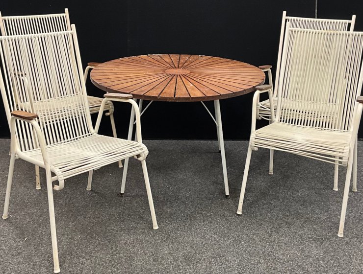 The late 20th century Daneline teak and white tubular metal circular garden table, 99.5cm diameter, with four famous “Spaghetti” chairs. The composite suite was saved from the skip and made £250 in a recent auction