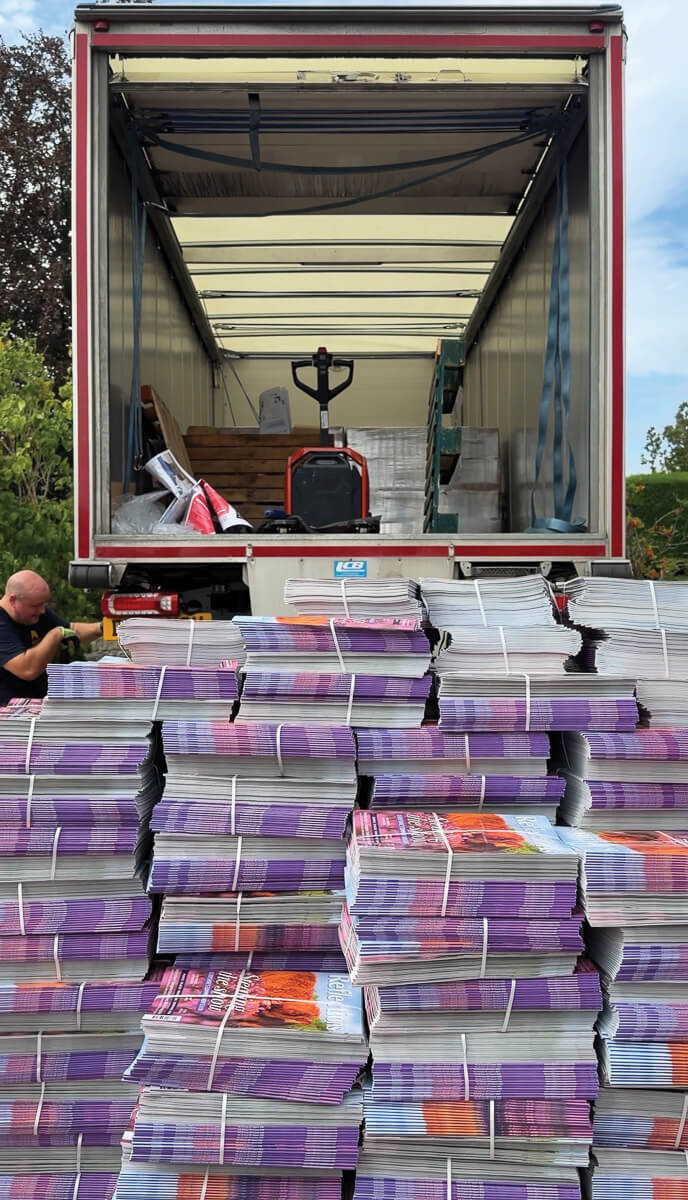 Piled up and ready for readers! A new edition of Reflections arrives by lorry from the printer ahead of delivery to homes and other outlets by our team of distributors